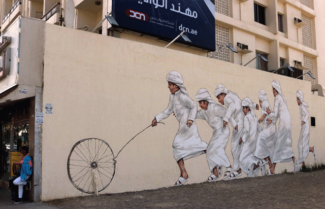 a picture taken on february 6 2017 shows graffiti by malaysian based lithuanian artist ernest zacharevic on a wall of dubai 039 s 2nd of december street which is part of the government funded dubai street museum project photo afp
