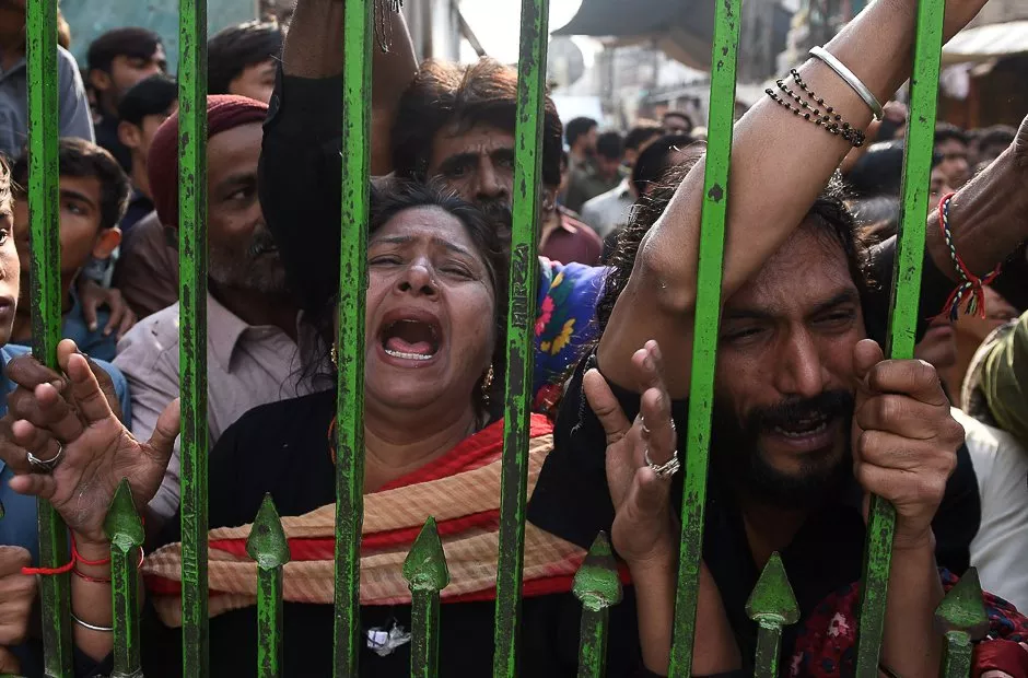 mourners gather outside closed gate of the lal shahbaz shrine photo afp mourners gather outside closed gate of the lal shahbaz shrine photo afp