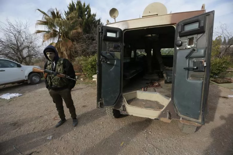 a rebel fighter stands with his weapon near a military vehicle on the outskirts of the northern syrian town of al bab syria february 8 2017 photo reuters khalil ashawi a rebel fighter stands with his weapon near a military vehicle on the outskirts of the northern syrian town of al bab syria february 8 2017 photo reuters khalil ashawi