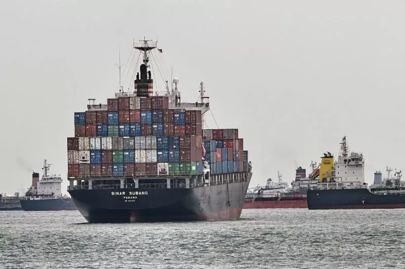 a fully loaded container vessel waits outside a container terminal in singapore on february 9 2017 photo afp a fully loaded container vessel waits outside a container terminal in singapore on february 9 2017 photo afp