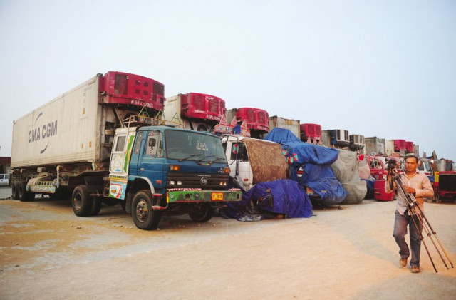 large trucks laden with containers carrying nato supplies are parked at a terminal in karachi the movement of heavy vehicles has been restricted during the daytime in the city photo file large trucks laden with containers carrying nato supplies are parked at a terminal in karachi the movement of heavy vehicles has been restricted during the daytime in the city photo file