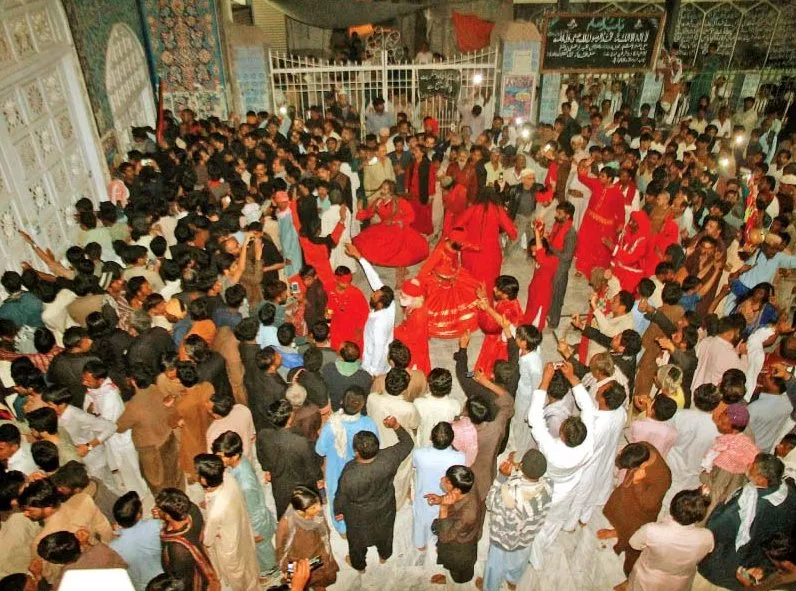 devotees perform dhamaal at the sehwan shrine a day after the blast photo athar khan express devotees perform dhamaal at the sehwan shrine a day after the blast photo athar khan express