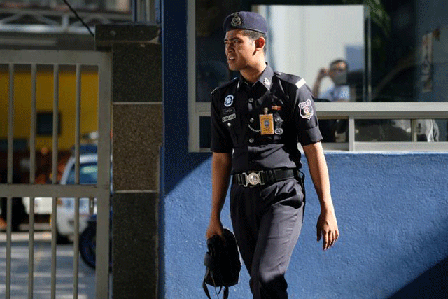 a police officer stands outside the morgue at kuala lumpur general hospital where kim jong nam 039 s body is held for autopsy in malaysia february 18 2017 photo reuters