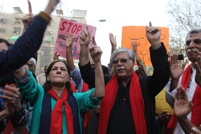 activists perform dhamal to the tune of dama dam mast qalandar outside karachi press club on saturday photo ayesha mir