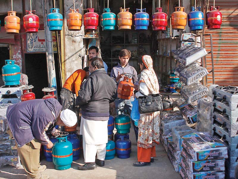 lpg cylinders on sale at a shop in shah alam market lahore photo express