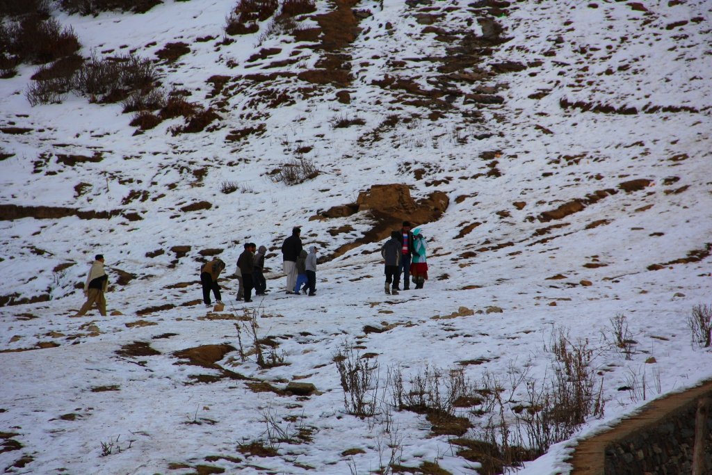 a flock of tourists enjoy snow at the valley photo fazal khaliq