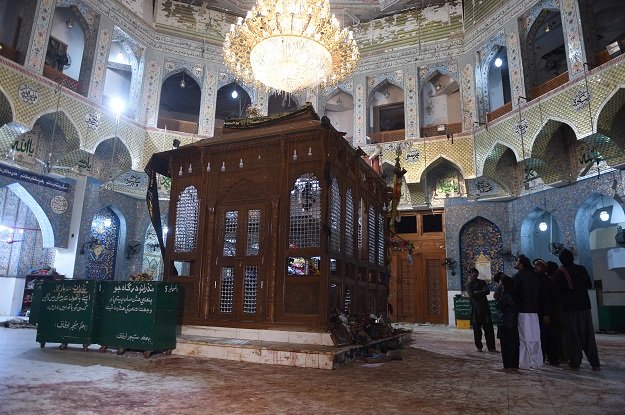 devotees stand on the blood stained floor a day after a bomb attack hit the 13th century muslim sufi shrine of lal shahbaz qalandar in the town of sehwan in sindh province some 200 kilometres northeast of the provincial capital karachi on february 17 2017 photo afp