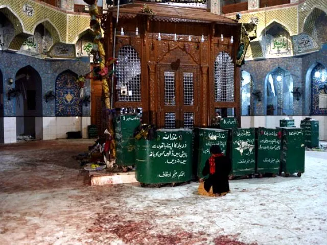 a devotee sits on the blood stained floor a day after a bomb attack hit the 13th century sufi shrine of lal shahbaz qalandar in the town of sehwan in sindh on february 17 2017 photo afp a devotee sits on the blood stained floor a day after a bomb attack hit the 13th century sufi shrine of lal shahbaz qalandar in the town of sehwan in sindh on february 17 2017 photo afp
