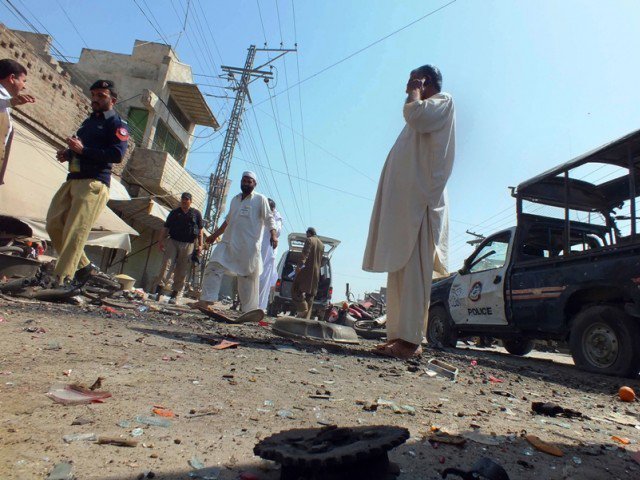 a file photo of security officials examining the site of a bomb explosion in bannu district of khyber pakhtunkhwa on march 12 2013 photo afp