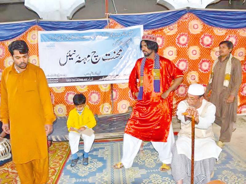 a group of people are staging a play in a village in sialkot photo express