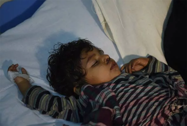 an injured child is treated at a local hospital in the town of sehwan a day after the bomb attack photo afp an injured child is treated at a local hospital in the town of sehwan a day after the bomb attack photo afp