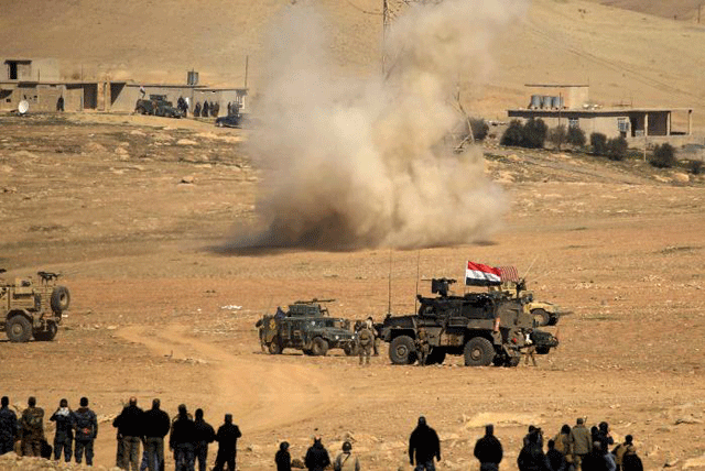 smoke rises after a rocket landed in the middle of the iraqi rapid response forces 039 position during a battle against islamic state militants in the south of mosul iraq february 19 2017 photo reuters