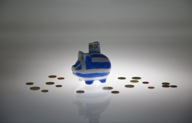a piggybank painted in the colours of the greek flag with a 20 euro banknote in it 039 s slot stands amongst various euro coins in this picture illustration taken in berlin germany june 30 2015 photo reuters a piggybank painted in the colours of the greek flag with a 20 euro banknote in it 039 s slot stands amongst various euro coins in this picture illustration taken in berlin germany june 30 2015 photo reuters