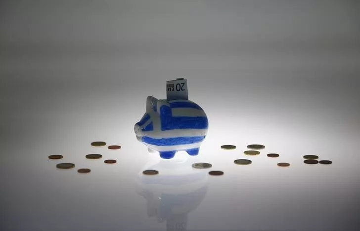 a piggybank painted in the colours of the greek flag with a 20 euro banknote in it 039 s slot stands amongst various euro coins in this picture illustration taken in berlin germany june 30 2015 photo reuters a piggybank painted in the colours of the greek flag with a 20 euro banknote in it 039 s slot stands amongst various euro coins in this picture illustration taken in berlin germany june 30 2015 photo reuters