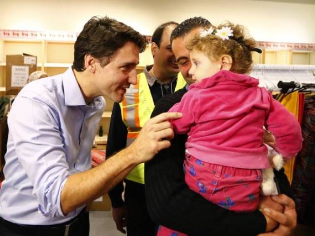 syrian refugees are greeted by canada 039 s prime minister justin trudeau at the toronto pearson international airport in mississauga ontario canada december 11 2015 photo reuters