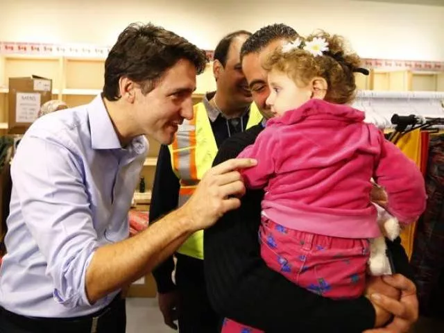 syrian refugees are greeted by canada 039 s prime minister justin trudeau at the toronto pearson international airport in mississauga ontario canada december 11 2015 photo reuters syrian refugees are greeted by canada 039 s prime minister justin trudeau at the toronto pearson international airport in mississauga ontario canada december 11 2015 photo reuters