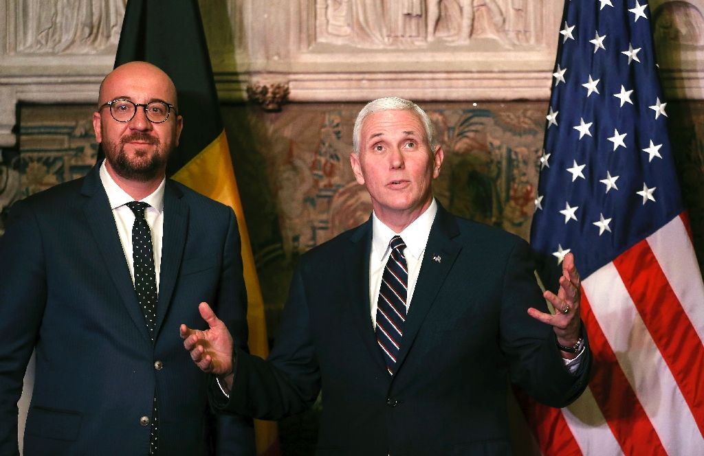 us vice president mike pence r talks to belgian prime minister charles michel at the end of a european tour meeting eu and nato leaders photo afp