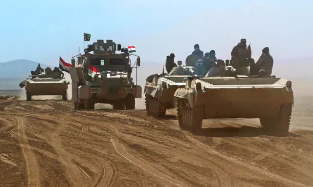iraqi forces armoured vehicles supported by the hashed al shaabi popular mobilisation paramilitaries advance towards the village of sheikh younis south of mosul after the offensive to retake the western side of the city from islamic state group fighters commenced on february 19 2017 photo afp iraqi forces armoured vehicles supported by the hashed al shaabi popular mobilisation paramilitaries advance towards the village of sheikh younis south of mosul after the offensive to retake the western side of the city from islamic state group fighters commenced on february 19 2017 photo afp