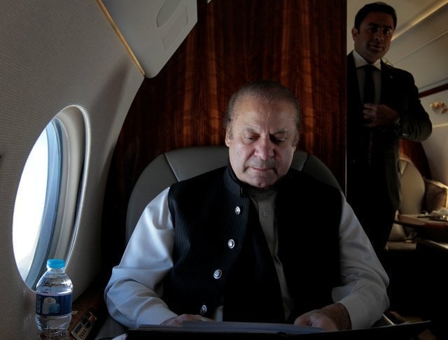 pakistani prime minister nawaz sharif works on his official plane as he travels to karachi to inaugurate the m9 motorway between hyderabad and karachi pakistan february 3 2017 reuters caren firouz