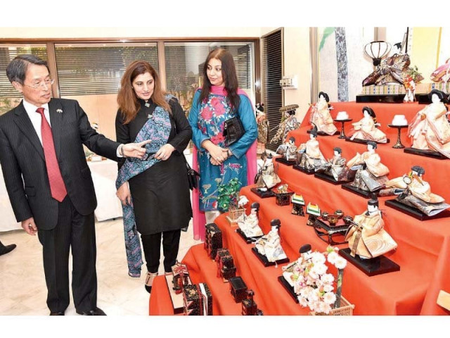 japanese ambassador takashi kurai explains the characters of various dolls on display at his home photo app japanese ambassador takashi kurai explains the characters of various dolls on display at his home photo app