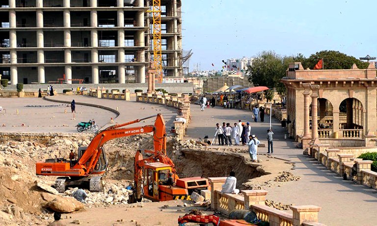 pakistani labourers work at a construction site of an underpass near a hindu temple in karachi photo afp