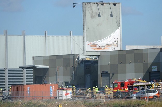 fire crew at the scene where a light plane crashed into the back of a building at essendon airport in melbourne australia february 21 2017 photo reuters