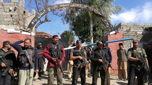 policemen stand guard at a courthouse after an attack by suicide bombers in charsadda on tuesday february 21 2017 photo reuters