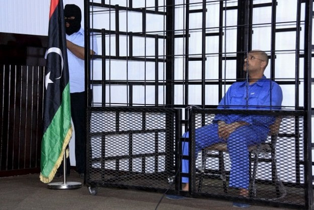 saif al islam gaddafi son of late libyan leader muammar gaddafi attends a hearing behind bars in a courtroom in zintan libya in this may 25 2014 file photo photo reuters saif al islam gaddafi son of late libyan leader muammar gaddafi attends a hearing behind bars in a courtroom in zintan libya in this may 25 2014 file photo photo reuters