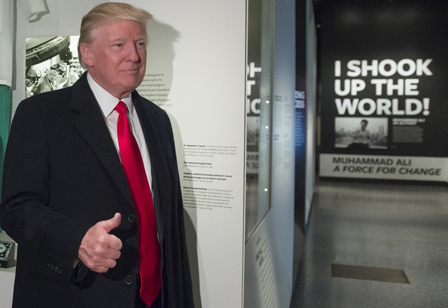 us president donald trump gives a thumbs up as he tours the smithsonian national museum of african american history and culture in washington dc february 21 2017 photo afp