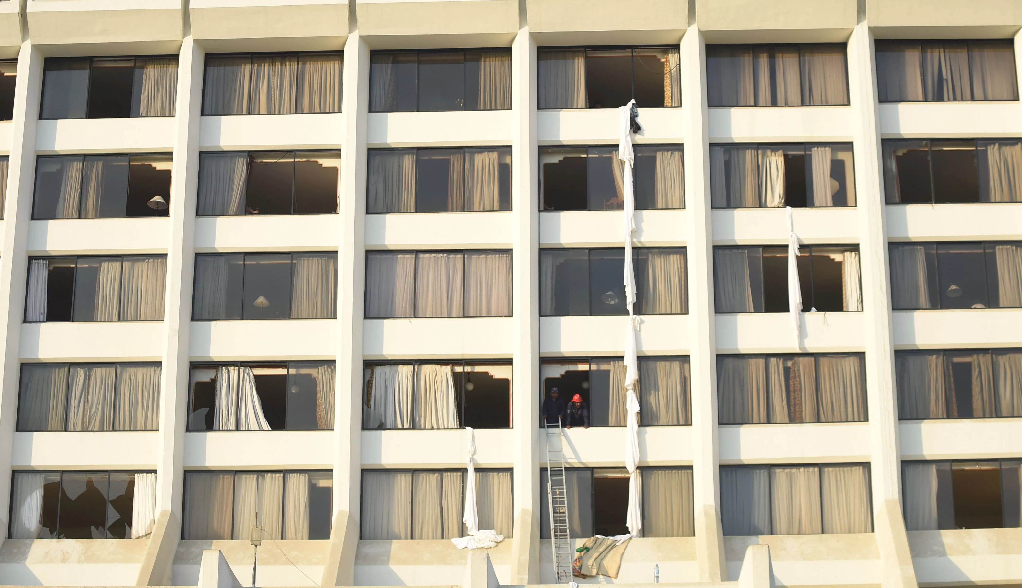 firefighters look from a room of regent plaza hotel following a fire on december 5 2016 which claimed 11 lives photo afp firefighters look from a room of regent plaza hotel following a fire on december 5 2016 which claimed 11 lives photo afp