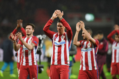 atletico weather late storm to seal advantage against leverkusen