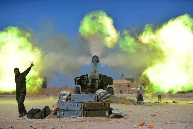 popular mobilisation forces pmf fires towards islamic state militants during a battle with islamic state militants west of mosul iraq february 22 2017 photo reuters