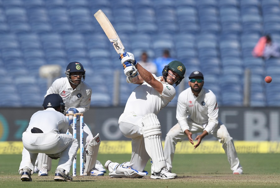 australia 039 s mitchell starc plays a shot as india 039 s ajinkya rahane l wriddhiman saha 2l and murali vijay r look on during the first day of the first test cricket match between india and australia at the maharashtra cricket association stadium in pune on february 23 2017 photo afp