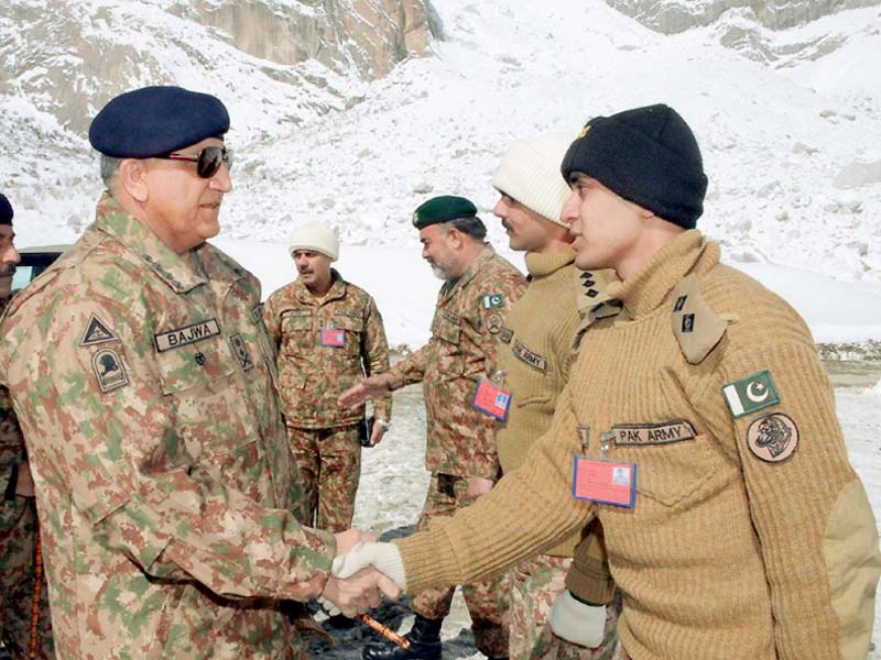 gen qamar meets an army officer while visiting siachen photo inp