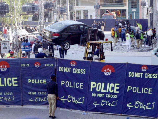 police officials cordon off the blast site in lahore s defence neighbourhood photo afp police officials cordon off the blast site in lahore s defence neighbourhood photo afp