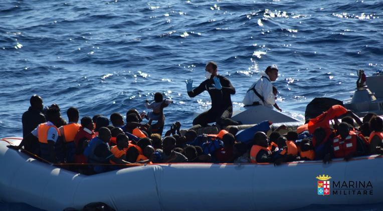 migrants sit in their rubber dinghy during a rescue operation by italian navy ship borsini unseen off the coast of sicily italy in this handout picture courtesy of the italian marina militare released july 19 2016 photo reuters
