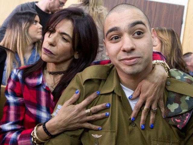 israeli soldier elor azaria is embraced by his mother at the start of is sentencing hearing at a military court in tel aviv israel february 21 2017 photo reuters