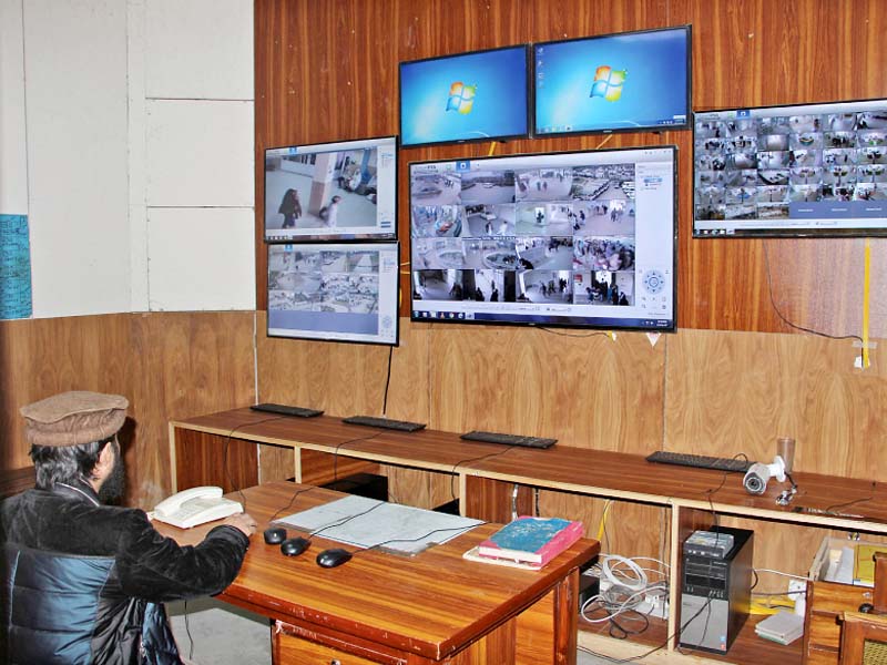 a hospital official monitors the cctv operation photo express