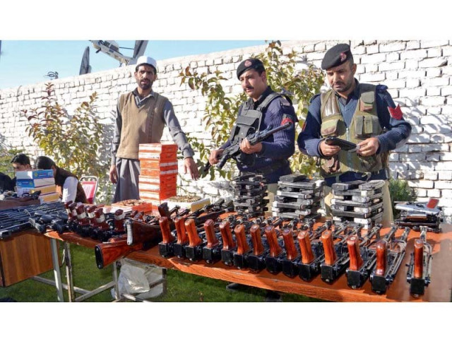 police display seized weapons and ammunitions at the chamkani police station in peshawar photo inp police display seized weapons and ammunitions at the chamkani police station in peshawar photo inp