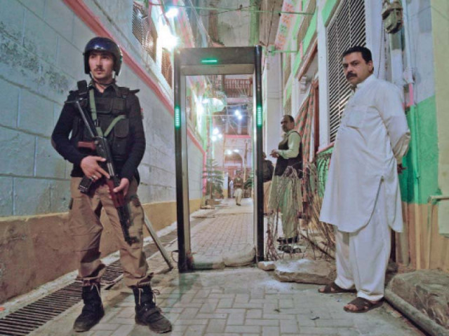 a police man stands guard outside the hindu dargah in peshawar photo muhammad iqbal express a police man stands guard outside the hindu dargah in peshawar photo muhammad iqbal express