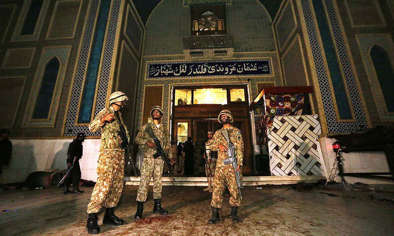 soldiers stand guard outside lal shahbaz qalandar 039 s shrine the shrine was targeted by a suicide bomber on february 16 which claimed over 80 lives photo app