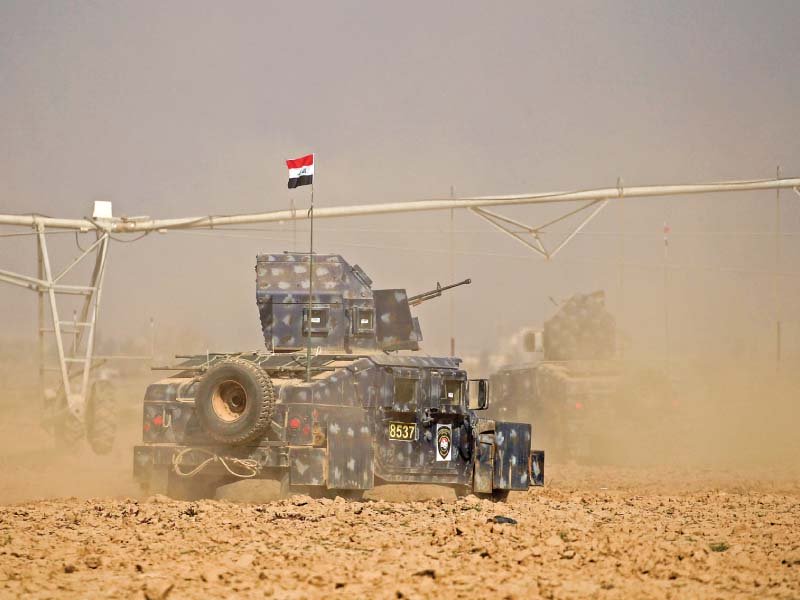 rapid response forces members cross farmland during battle with is militants photo reuters