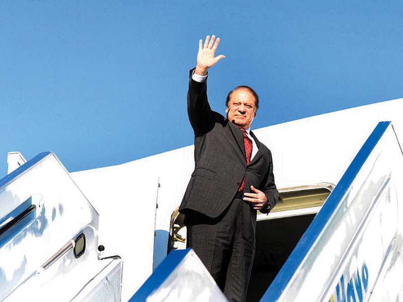 premier nawaz waves as he boards the return flight to pakistan photo app