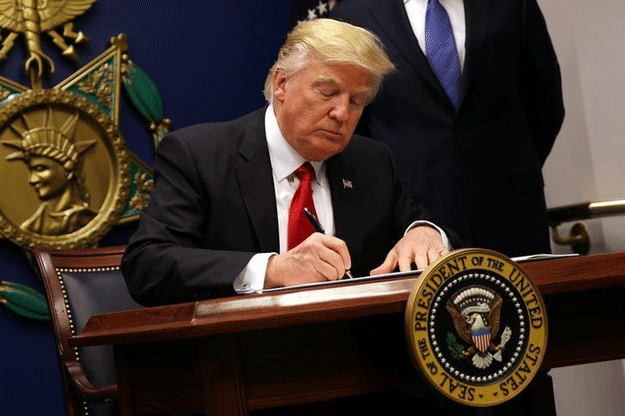 us president donald trump signs an executive order to impose tighter vetting of travelers entering the united states at the pentagon in washington us photo reuters