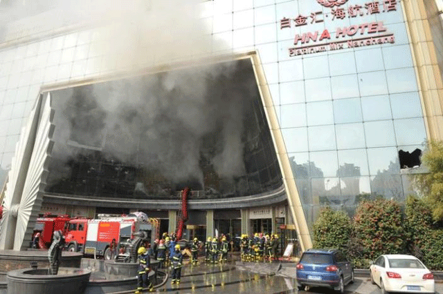 firefighters are seen at the site after a fire broke out at hna hotel in nanchang jiangxi province february 25 2017 photo reuters