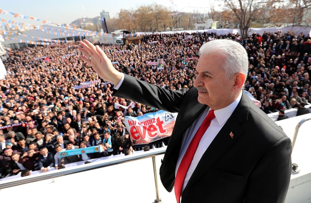 this handout photo released by the turkish prime ministry press office on february 25 2017 shows turkish prime minister and leader of the ruling justice and development ak party binali yildirim greeting supporters who wait outside during a public meeting at ankara 039 s arena to promote support for an april referendum on whether to boost the turkish president 039 s powers photo afp