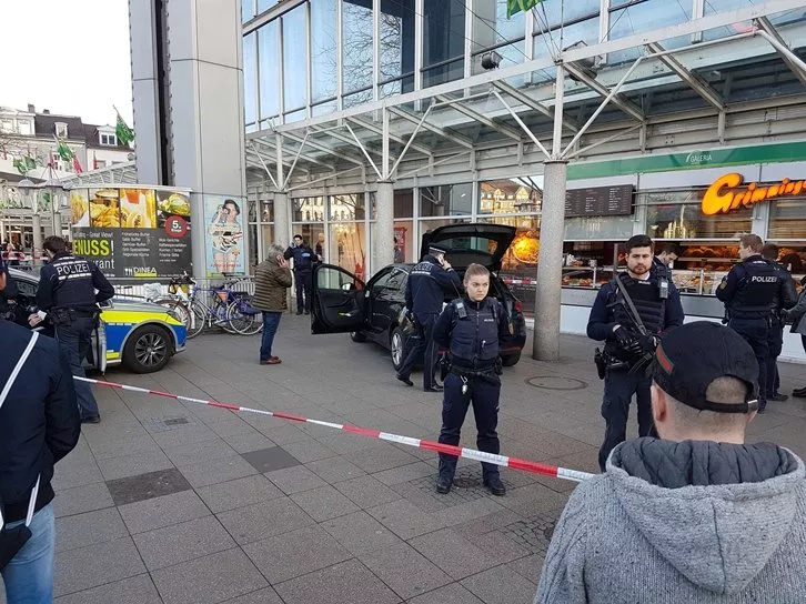 german policemen stand around a car in front of a business building in heidelberg where a man ploughed into pedestrians photo afp german policemen stand around a car in front of a business building in heidelberg where a man ploughed into pedestrians photo afp