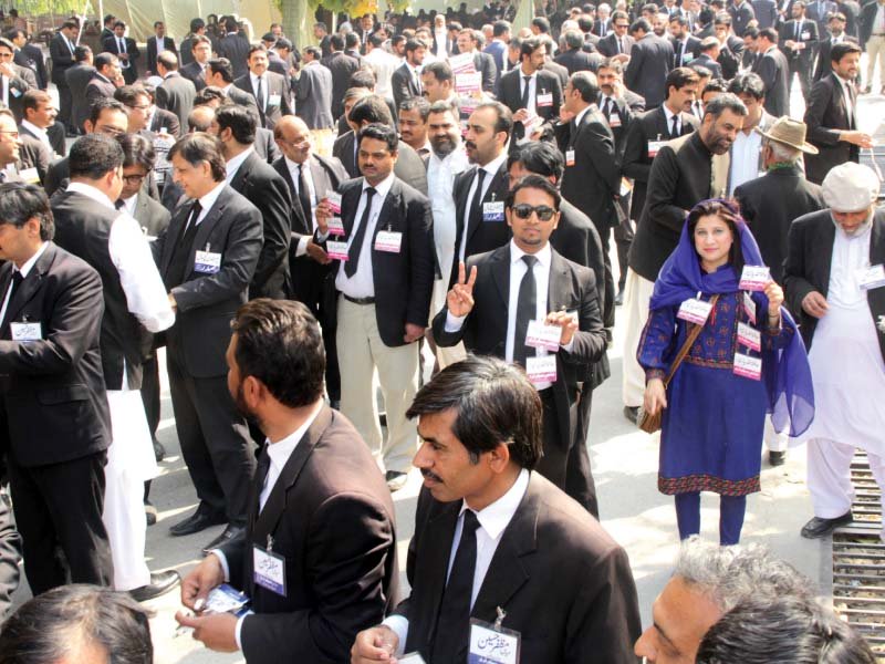 lawyers wait outside the lahore high court building to cast their vote photo abid nawaz express
