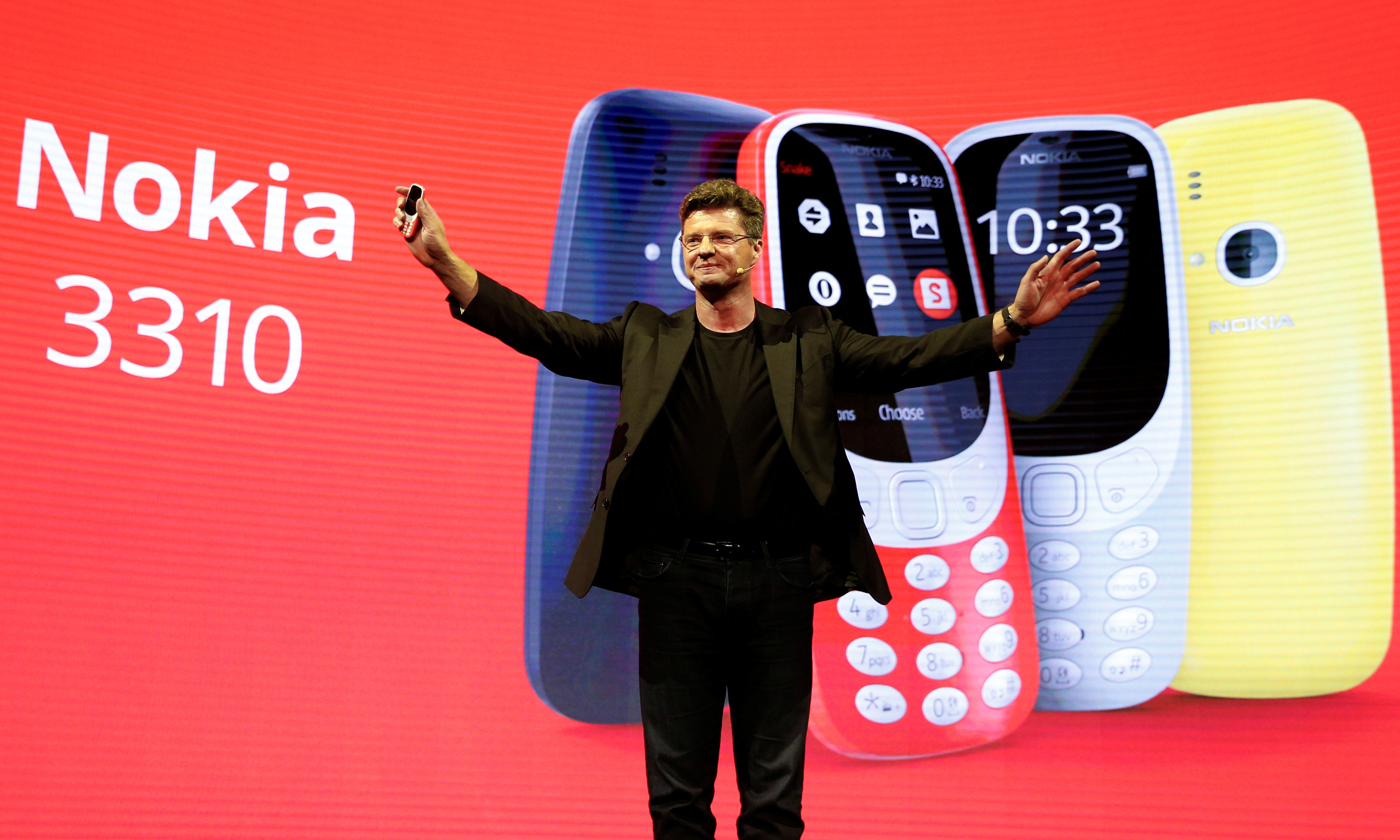 arto nummela ceo of nokia hmd holds up a nokia 3310 device during a presentation ceremony at mobile world congress in barcelona spain february 26 2017 photo afp