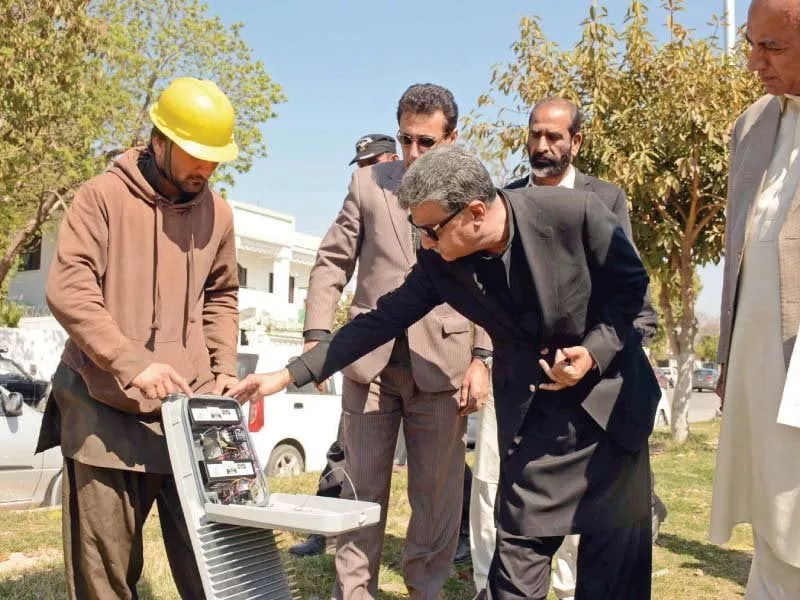 a technician explains the working of a led streetlight to mayor ansar aziz photo waseem nazir express a technician explains the working of a led streetlight to mayor ansar aziz photo waseem nazir express